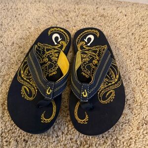 Olukai kids size 13 Blue & Yellow Flip Flop Sandals with Dragon Print